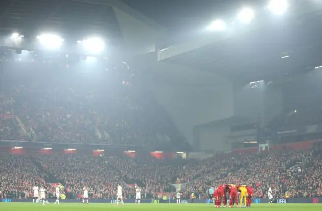 Liverpool players form a huddle before their clash against Bayer Leverkusen