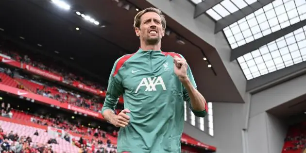 Peter Crouch warms up for Liverpool at Anfield