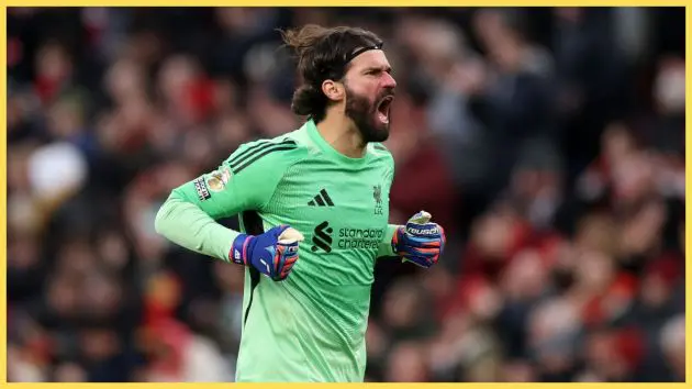 Alisson Becker celebrates to the Kop against Wolves