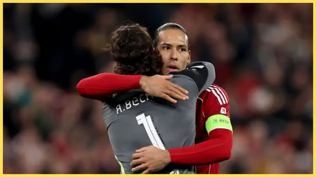 Alisson Becker hugs Virgil van Dijk during Liverpool game.