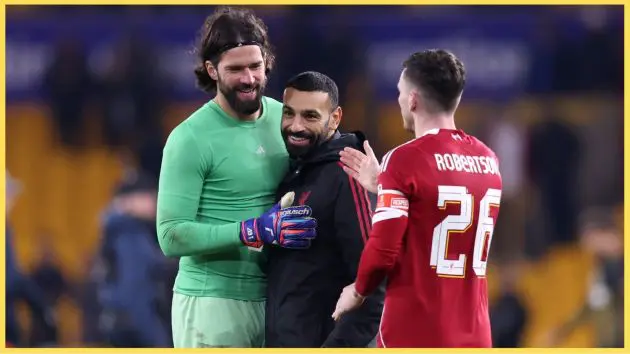 Alisson and Andy Robertson celebrate with Mo Salah after Liverpool's win over Wolves