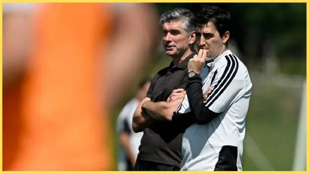 Richard Hughes and Andoni Iraola watch on during a Liverpool training session
