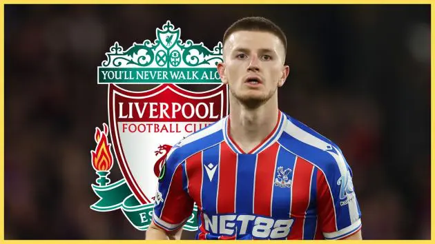 Liverpool transfer target Adam Wharton looks on during Crystal Palace game in front of LFC badge.