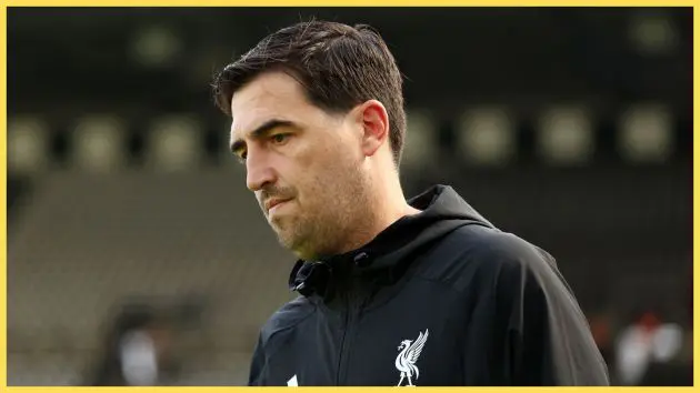 Liverpool manager Andoni Iraola looks downward.