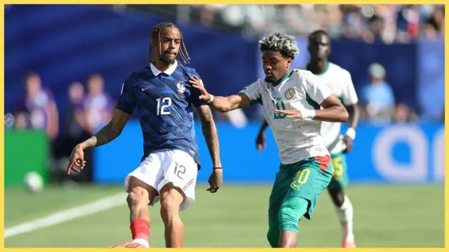 Bradley Barcola dribbles against Liverpool transfer target Ibrahim Mbaye during World Cup game.