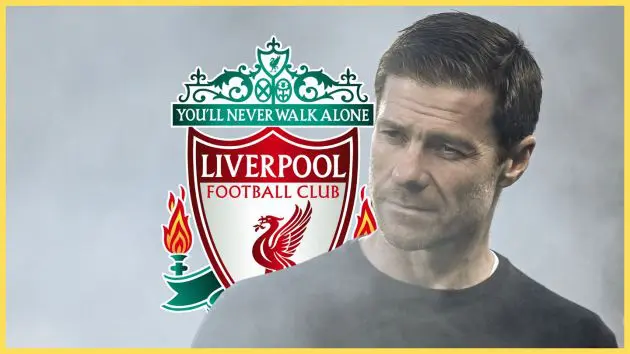 Chelsea manager Xabi Alonso looks on in front of Liverpool club crest.