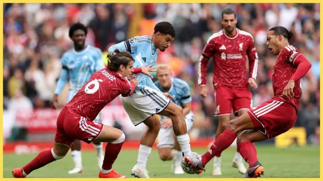 Liverpool FC defenders Mikos Kerkez and Virgil van Dijk attempt to tackle Morgan Gibbs-White.