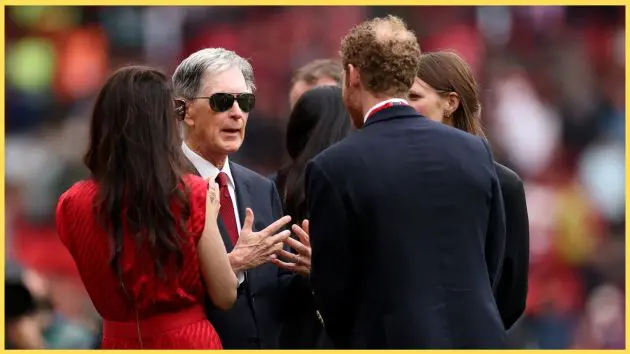 John Henry in discussion on the touchline at Anfield